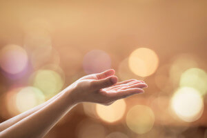 Empty female women open human hand prayer palms up Candle night light natural warm gold lantern bokeh Pray support aid destiny help peace campaign: Holy spirit week: World religion day: Eid mubarak